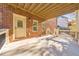 Covered patio with brick walls and access to backyard at 2423 Rosapenna Nw Ln, Kennesaw, GA 30152