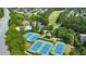 Aerial view showcasing tennis courts, pool, and community homes at 2423 Rosapenna Nw Ln, Kennesaw, GA 30152