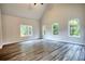 Living room with hardwood floors and multiple windows at 960 Park Place St, Social Circle, GA 30025