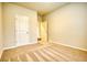 Spacious bedroom with neutral carpeting and private access to a bathroom at 960 Park Place St, Social Circle, GA 30025