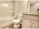 Clean bathroom with shower/tub combo and granite countertop at 960 Park Place St, Social Circle, GA 30025
