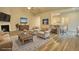 Virtually staged living room with fireplace and kitchen view at 960 Park Place St, Social Circle, GA 30025