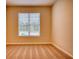 Well-lit bedroom featuring neutral carpeting and window blinds at 960 Park Place St, Social Circle, GA 30025