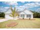 Brick ranch home with attached garage and landscaping at 960 Park Place St, Social Circle, GA 30025
