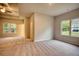 Large bedroom with carpet, window, and access to bathroom at 960 Park Place St, Social Circle, GA 30025