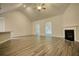 High-ceilinged living area with hardwood floors and fireplace at 960 Park Place St, Social Circle, GA 30025