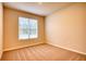 Spacious bedroom with neutral carpeting and large window at 960 Park Place St, Social Circle, GA 30025