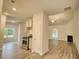 Open kitchen with stainless steel appliances and light cabinets at 960 Park Place St, Social Circle, GA 30025
