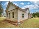 Side view of house showcasing brick exterior and yard at 960 Park Place St, Social Circle, GA 30025