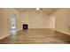Spacious living room featuring hardwood floors and a corner fireplace at 960 Park Place St, Social Circle, GA 30025