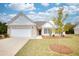 Brick ranch home with attached garage and landscaping at 960 Park Place St, Social Circle, GA 30025