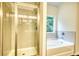 Bathroom with walk-in shower and garden tub at 960 Park Place St, Social Circle, GA 30025