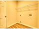 Bright laundry room with built-in shelving and vinyl flooring at 960 Park Place St, Social Circle, GA 30025