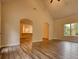 Open living room with hardwood floors and archways at 960 Park Place St, Social Circle, GA 30025