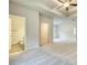 Main bedroom with carpet and access to bathroom and closet at 960 Park Place St, Social Circle, GA 30025