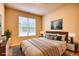 Bright bedroom featuring a comfortable bed and large window at 960 Park Place St, Social Circle, GA 30025