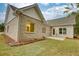 Rear view of house with patio and grassy yard at 960 Park Place St, Social Circle, GA 30025