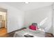 Bedroom with wood-look flooring and bathroom access at 4012 Union Church Sw Rd, Stockbridge, GA 30281