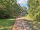 Long driveway leading to a charming house nestled among lush trees at 4012 Union Church Sw Rd, Stockbridge, GA 30281