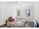 Bedroom with wood-look flooring and large window at 4012 Union Church Sw Rd, Stockbridge, GA 30281
