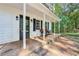 Inviting front porch with rocking chairs and a welcoming doormat at 4012 Union Church Sw Rd, Stockbridge, GA 30281