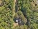 House surrounded by lush green trees, seen from above at 4012 Union Church Sw Rd, Stockbridge, GA 30281