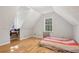Upstairs bedroom with laminate flooring and multiple windows at 4012 Union Church Sw Rd, Stockbridge, GA 30281