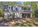 Two-story white house with black shutters and a front porch at 4012 Union Church Sw Rd, Stockbridge, GA 30281