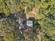 Aerial view showing a house nestled in a wooded area at 4012 Union Church Sw Rd, Stockbridge, GA 30281