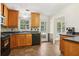 Kitchen with wood cabinets, tile backsplash, and stainless steel appliances at 4012 Union Church Sw Rd, Stockbridge, GA 30281