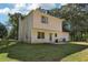 Rear view of house, showcasing white siding and patio at 4012 Union Church Sw Rd, Stockbridge, GA 30281
