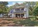 Two-story white house with black shutters and a front porch at 4012 Union Church Sw Rd, Stockbridge, GA 30281