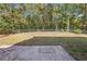 Large backyard with grassy area and chain link fence at 4012 Union Church Sw Rd, Stockbridge, GA 30281