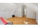 Upstairs bedroom with laminate flooring and access to a hallway at 4012 Union Church Sw Rd, Stockbridge, GA 30281