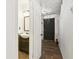 Clean entryway with dark brown tile floor and half bath at 4012 Union Church Sw Rd, Stockbridge, GA 30281