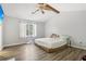 Main bedroom with wood-look floors and ceiling fan at 4012 Union Church Sw Rd, Stockbridge, GA 30281