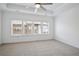 Bright bedroom with neutral carpet and large windows at 6833 Crescendo Ct, Atlanta, GA 30328