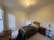 Comfortable bedroom with a queen-size bed and ample natural light at 220 Spalding Lake Pl, Atlanta, GA 30350