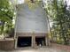 Two-car garage with brick facade and ample storage space at 220 Spalding Lake Pl, Atlanta, GA 30350