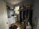 Convenient laundry room with washer, dryer, and shelving at 220 Spalding Lake Pl, Atlanta, GA 30350