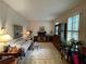 Living room featuring a sofa, and a wooden cabinet at 220 Spalding Lake Pl, Atlanta, GA 30350
