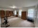 Spacious bedroom with built-in shelving and wood furniture at 220 Spalding Lake Pl, Atlanta, GA 30350