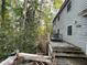 Elevated deck overlooking wooded area, offering peaceful views at 220 Spalding Lake Pl, Atlanta, GA 30350