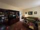 Spacious living room with built-in shelving and hardwood floors at 220 Spalding Lake Pl, Atlanta, GA 30350