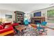 Bright living room featuring a fireplace, comfortable seating, and built-in shelving at 1053 Riverbend Club Se Dr, Atlanta, GA 30339