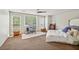Spacious bedroom with a large bed, built-in desk and ample natural light at 1053 Riverbend Club Se Dr, Atlanta, GA 30339