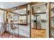 Kitchen features a breakfast bar, stainless steel appliances, and terracotta tile floors at 1053 Riverbend Club Se Dr, Atlanta, GA 30339