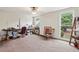Home office with a desk, chair, and large window overlooking the backyard at 1053 Riverbend Club Se Dr, Atlanta, GA 30339
