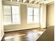 Bright living room with hardwood floors and large windows at 32 Peachtree Nw St # 1006, Atlanta, GA 30303