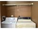 Stackable washer and dryer in a small laundry closet at 32 Peachtree Nw St # 1006, Atlanta, GA 30303